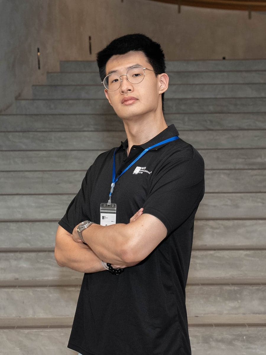 Zhang Jucai in a club polo shirt